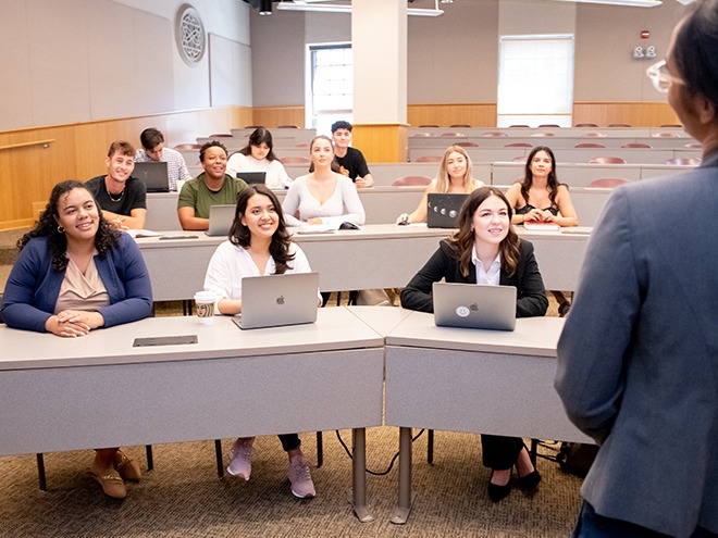 Students listening to a professor during a lecture