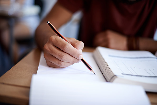 student taking notes