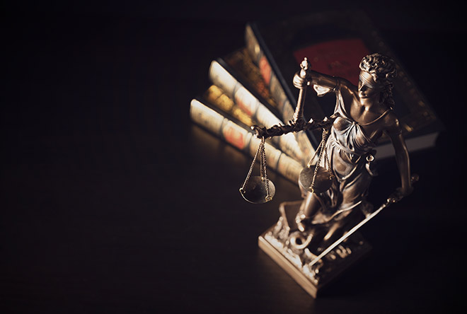 Justice statue with books