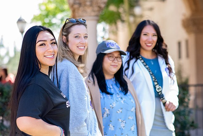 four female students hanging out at Balboa Park