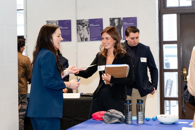 Student handing Employer a Résumé