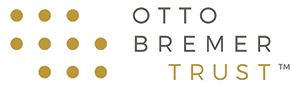 The Otto Bremer Trust logo in grey and gold.