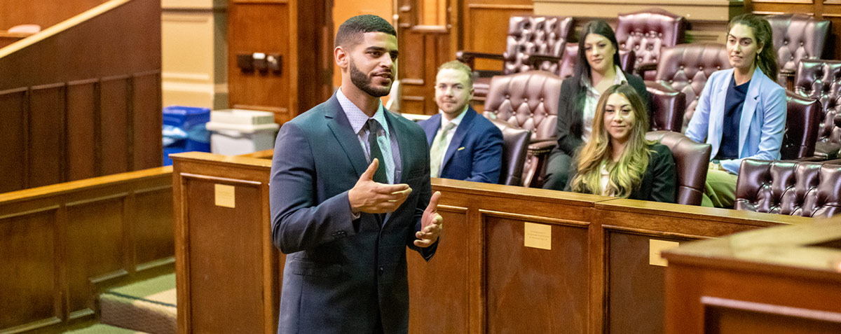 male student cross examination in  moot courtroom 