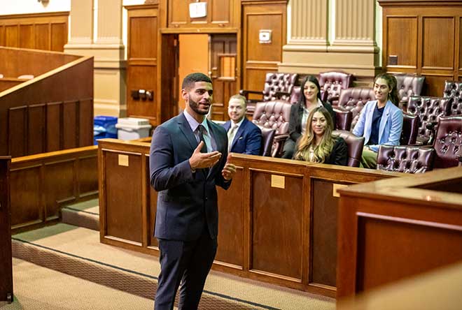 student cross examining a witness in moot court