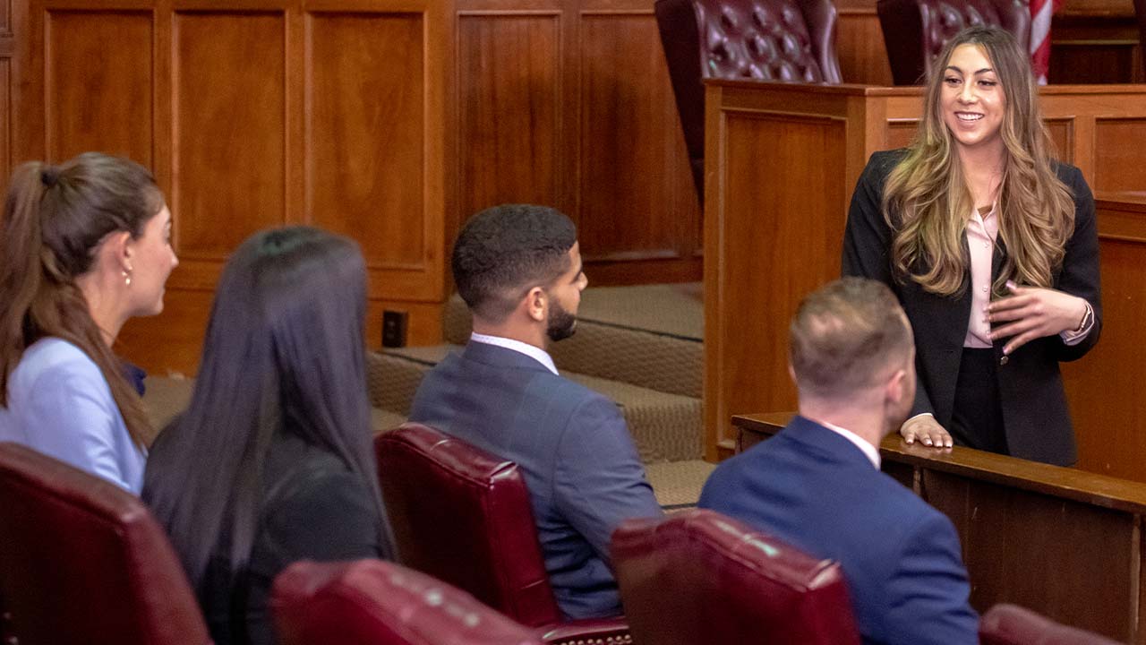 female student talking to jury