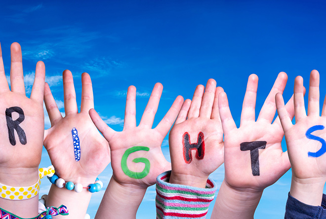 Kid hands that spell out the word rights