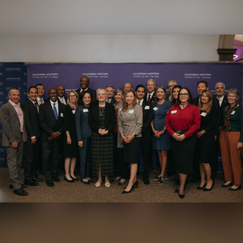 Dean and President & Professor of Law Miriam H. Baer poses for a photo with judges and commissioners