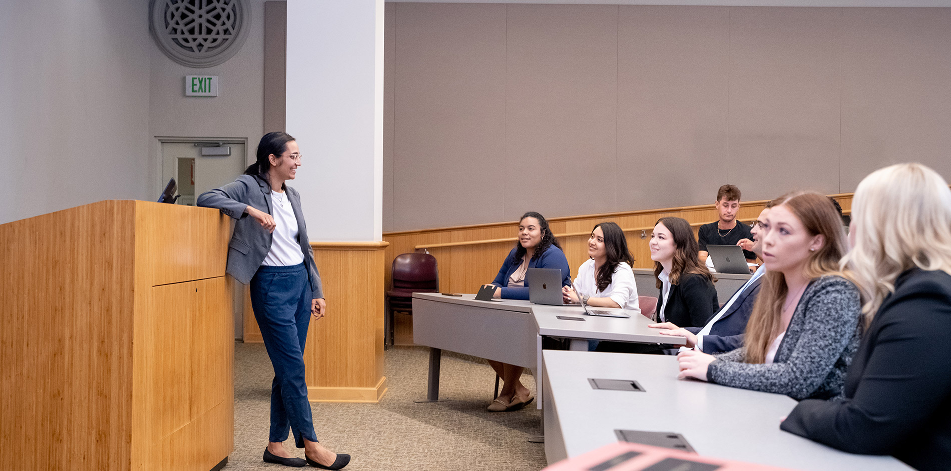 Professor Dadhania talking with student during a lecture