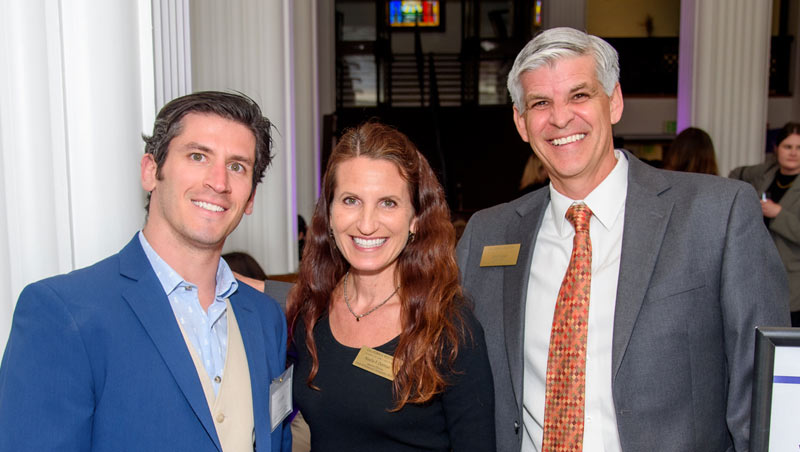 (Right) Assistant Dean of Career & Professional Development John McKee poses with CPDO’s Austin Lucas (left) and Noelle Dorman (middle) at the Public Service and Pro Bono Honor Societies’ Induction Ceremony. 