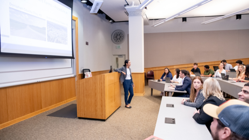 Professor Pooja Dadhania presents a lecture to her class.