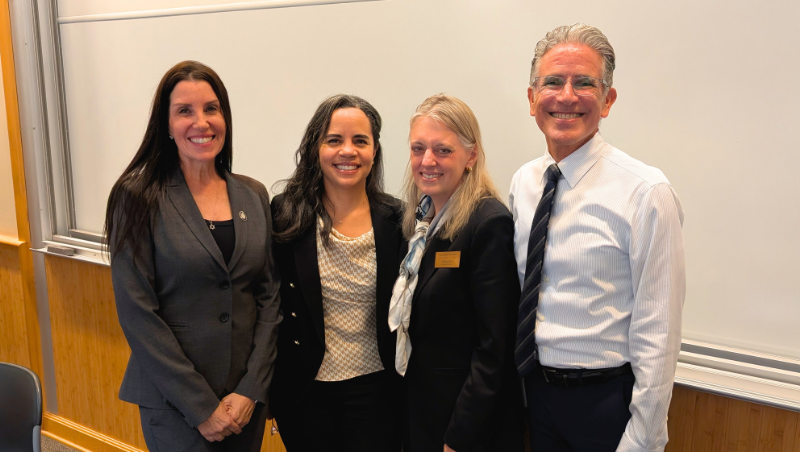Professor Jessica Fink, Professor Lisa Shaw Roy, Dean Miriam Baer, and Professor William Aceves at the First Monday program