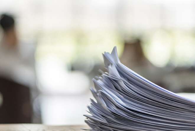 a stack of papers on a table