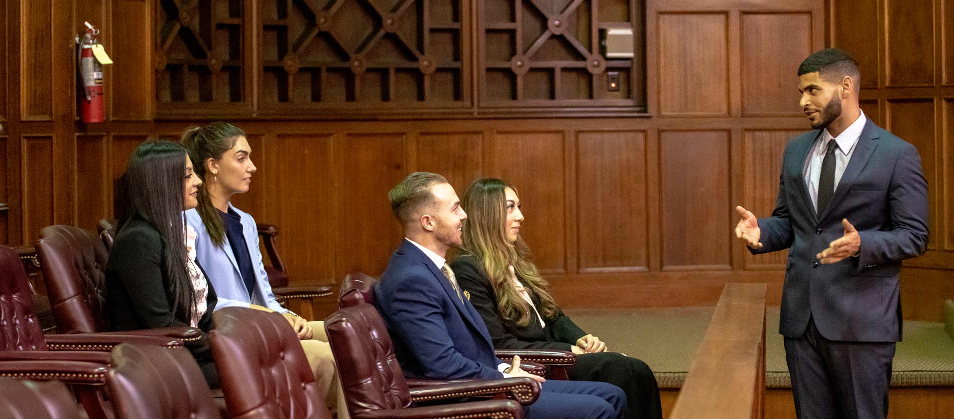 Student talking to the jury in the moot courtroom