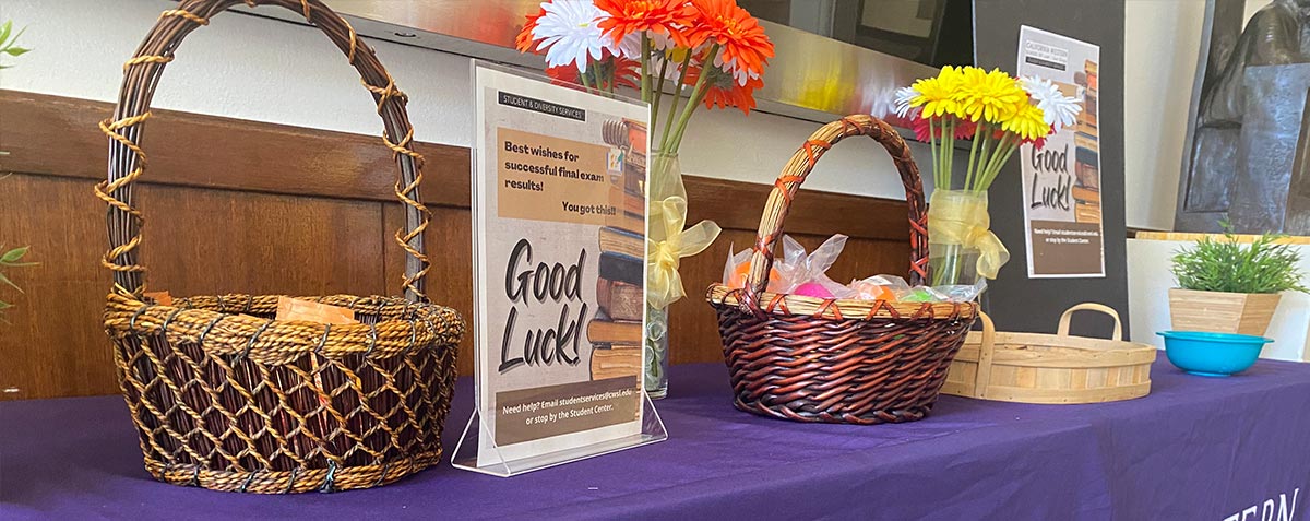 table with good luck poster and candy