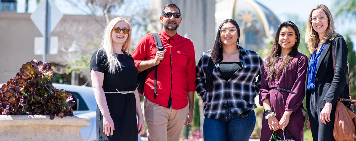 students at Balboa Park with dome in background