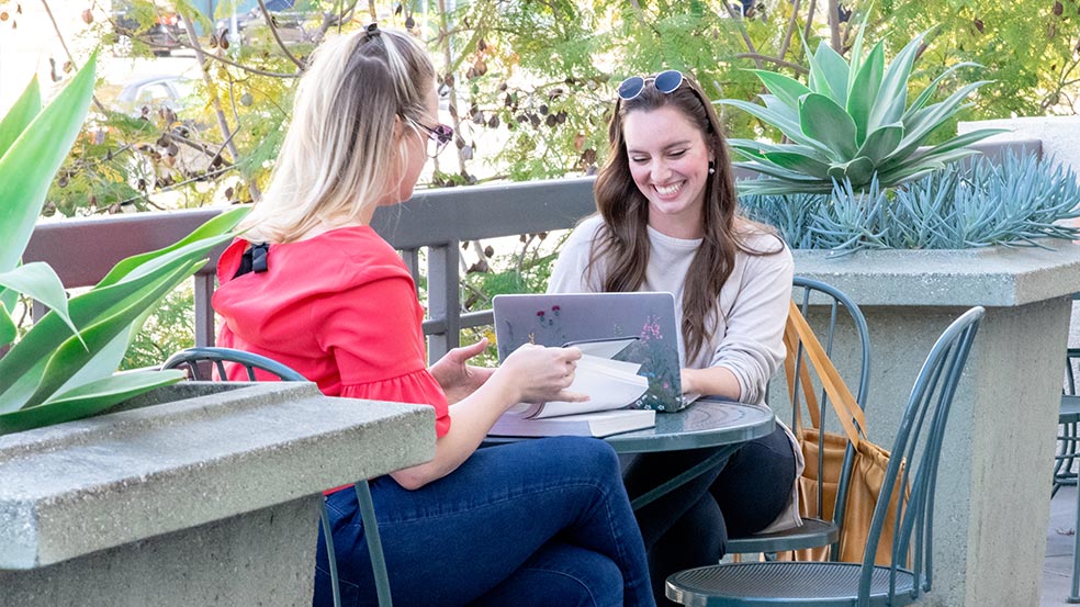 students sitting in the courtyard